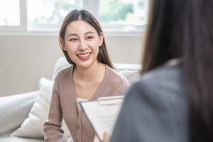 a person talks to a therapist in a case management program