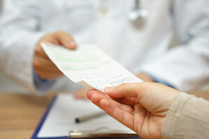 a person receives a doctor in a medication management program