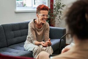 a person talks to a therapist in an lgbtq-friendly rehab center