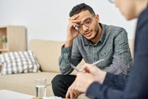a person talks to a therapist in a meth detox center